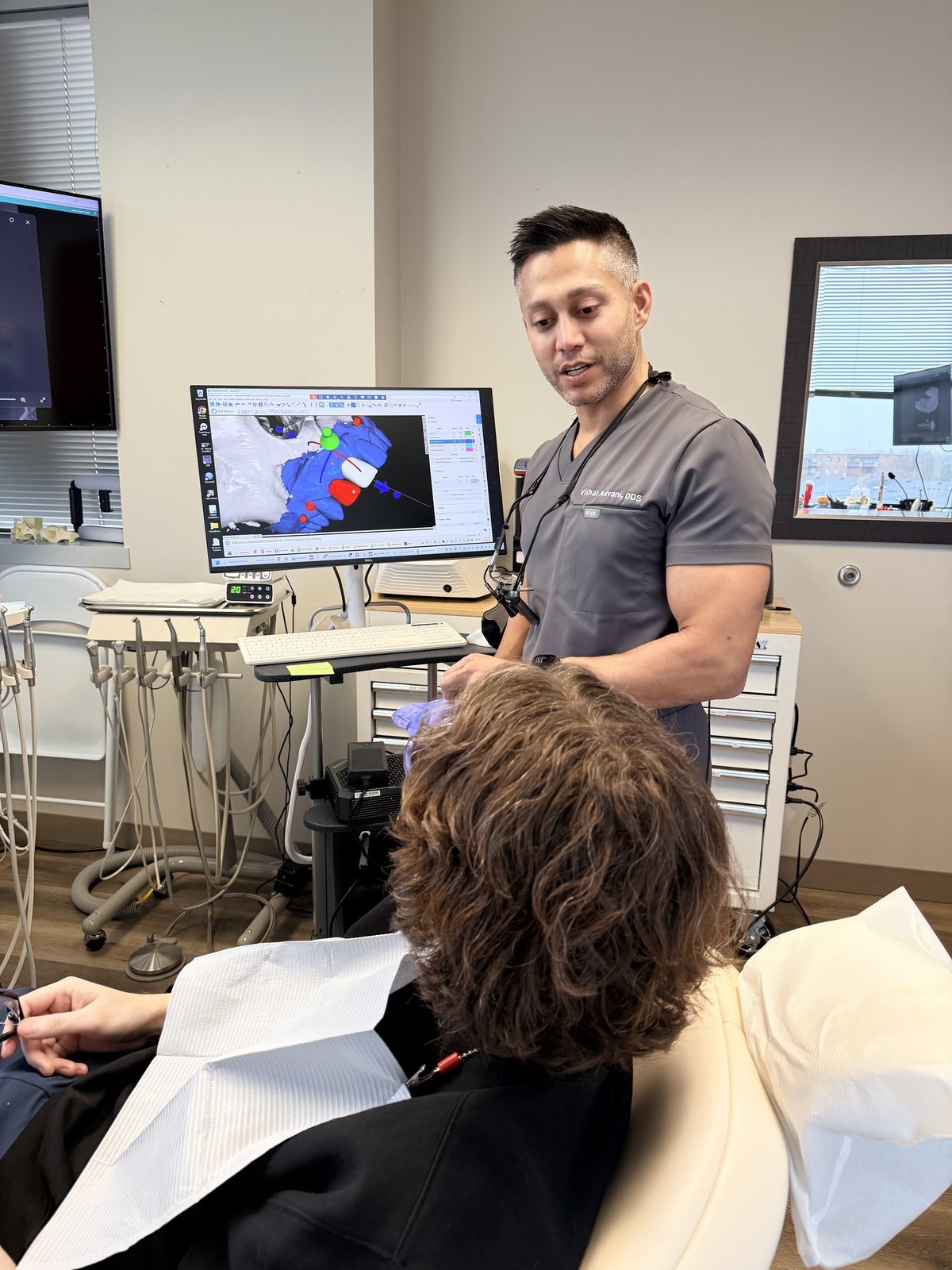 Dr. Advani reviewing 3D treatment plan with patient